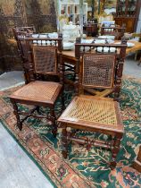 A set of six Victorian French oak Bergère dining chairs with decorative brass handles and carved