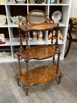 A Victorian walnut three tier what-not of graduating size with mirror to top, 107cm x 71.5cm