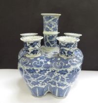 A Chinese blue and white porcelain tulip vase, scrolled foliate design, restored to central section,