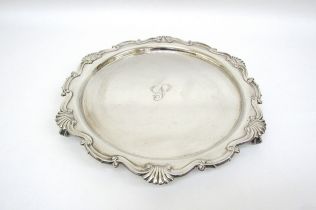 A Martin Hall and Co silver salver on claw and ball feet, Sheffield 1911, 32cm diameter, 800g