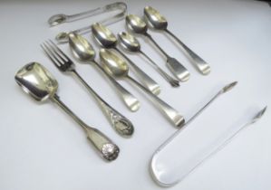 Two silver sugar nips, various silver teaspoons, caddy spoon and small fork, 190g