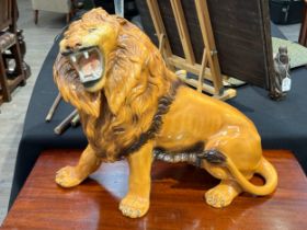 A Favaro Cecchello, Italy, figure of a lion roaring, 44cm tall, 57cm long