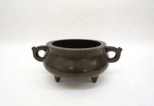 A Chinese tripod censer, seal mark to base, 8cm tall