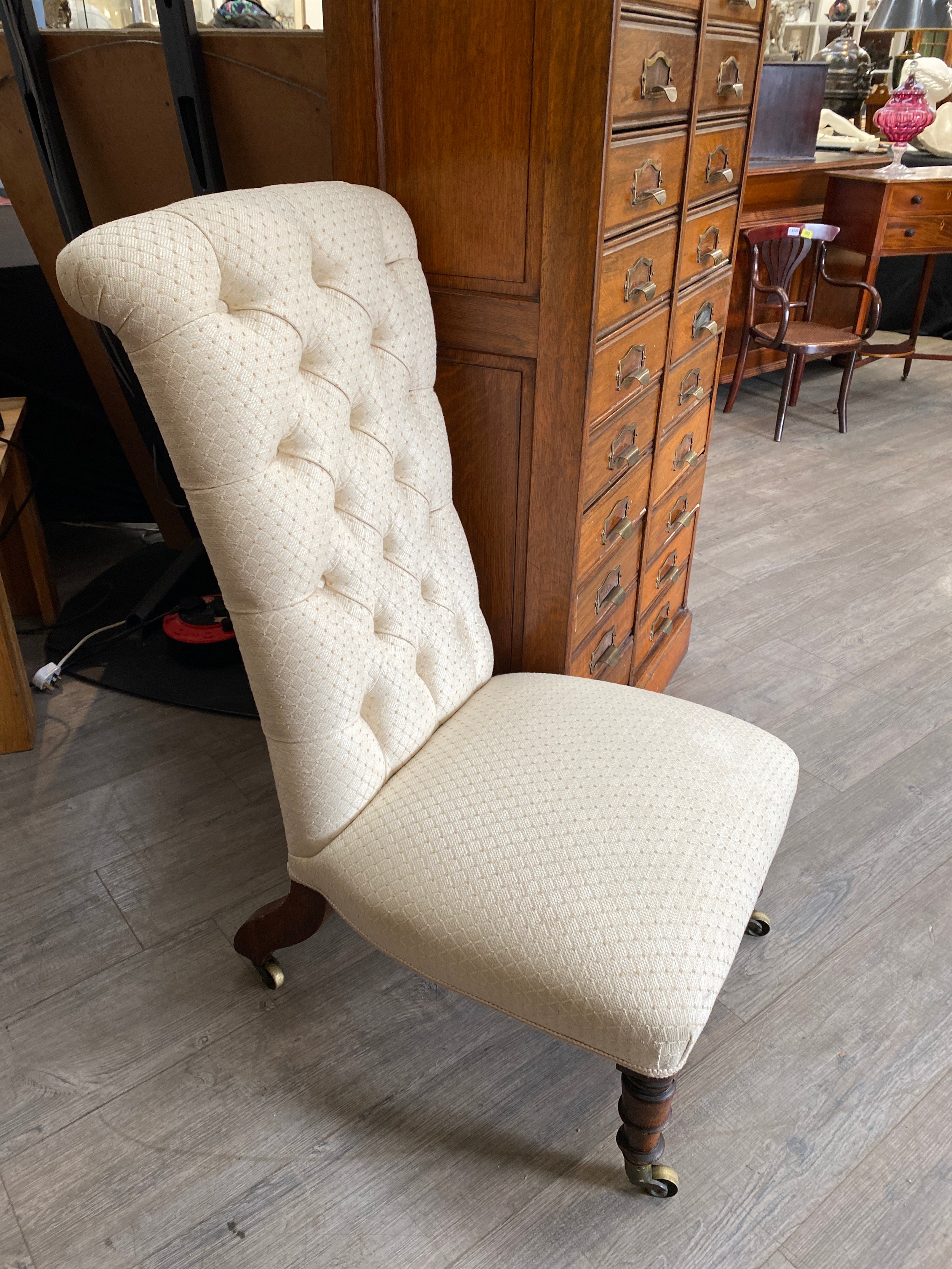 A Victorian button back nursing chair with oak legs to castors, 96cm tall x 50cm wide - Image 3 of 3
