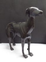 A cast metal whippet, 28.5cm tall x 36cm long