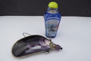 A scent bottle with mollusc shell body and gilt mounts with cork stopper and an oriental design
