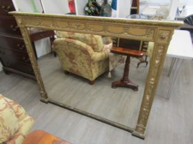 A 19th century gilt an gesso overmantel mirror with ribbon and swag detail, some gesso elements