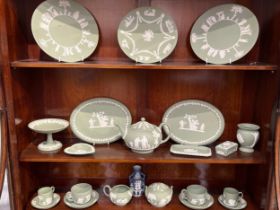 A collection of 20th Century green Wedgwood jasperware, approximately 19 pieces