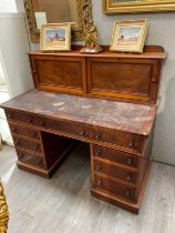 A Victorian mahogany twin pedestal estate desk with sliding cupboard pigeon hole top, veneer