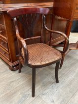 A "Jacob and Josef Kohn Wein" Austrian childs' Bentwood and cane seat armchair (labels to verso),
