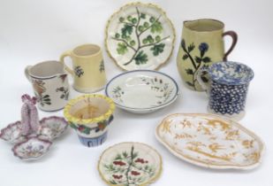 Mixed French Faience ceramics including jugs, mugs, dishes, plates and dolphin dish, some items with