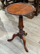 A Victorian mahogany tripod table, circular top over turned column, 62cm tall, 38.5cm diameter