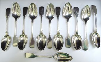 A matched set of twelve silver dessert spoons, including six Henry Holland, London 1862, five Benoni