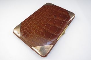 A leather crocodile skin effect wallet/card case with 9ct gold corner mounts, 13cm x 9cm
