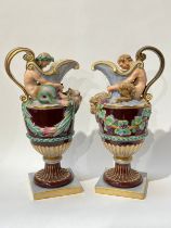A pair of late 19th/early 20th Century Naples jugs with Merman and Pan to spout, 40cm tall, approx