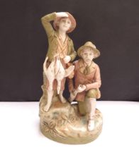 A Royal Dux figure of game hunters, model 2440, 22.5cm tall