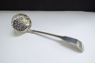 An early Victorian silver sifting spoon, makers mark rubbed, London 1861, 52g