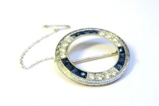 An Art Deco style circular brooch, each third set with four brilliant cut diamonds and four square