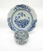 An 18th Century Chinese blue and white jar with cover, floral panels and an early 19th Century