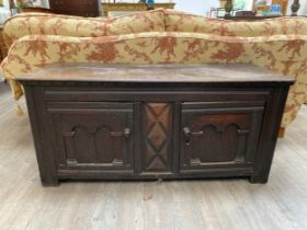 An 18th Century oak two door low cupboard possibly the top of a court cupboard, 61cm x 129cm x 48cm