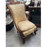 A circa 1840 mahogany scroll back slipper chair the serpentine front seat over carved scroll
