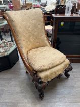 A circa 1840 mahogany scroll back slipper chair the serpentine front seat over carved scroll