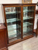 A Victorian apothecary display cabinet with mirrored back, adjustable shelves interior, two doors,