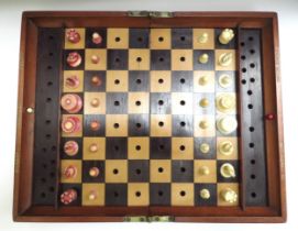 A Jacques London mahogany cased travelling chess set with stained red bone and natural pieces,