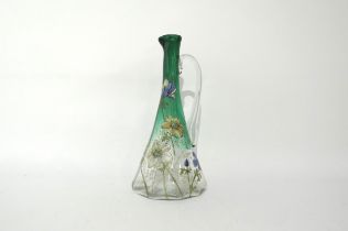 A late 19th Century faceted jug. Hand painted enamel floral detail, possibly Emile Galle, 26cm tall