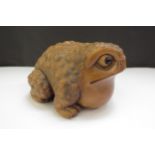 A Meiji period Japanese boxwood carved toad, 9.5cm long, 6cm tall