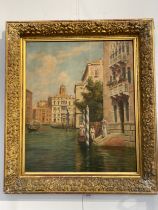 TREVOR HADDON (1864-1941): An oil on canvas, punting on a Venetian canal, lady with parasol boarding