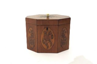 A 19th Century mixed wood octagonal tea caddy with velvet lined interior. The top and three front