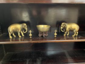 An Oriental singing bowl, pair of brass elephants and two miniature brass scent bottles (5)