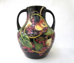 A Moorcroft Queen's Choice pattern large twin handled vase, by Emma Bossons. Second, 34cm tall