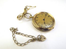 A gold fob watch marked 18k with a bow pin, 37.9g total and a 9ct gold bracelet, 2.3g