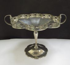 A silver tazza, the lobed dish with pierced galleried border, two handles. raised on a tapering