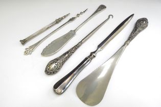 Silver and silver handled items including letter opener, propelling pencil, button hook, shoe horn