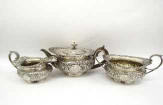 An Edward Barnard and Sons ornate silver three piece tea set,retailed by Mackay and Chisholm