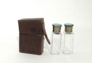 A leather cased twin silver and guilloche perfume/scent bottle set, Adie Bros Ltd, Birmingham
