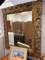 A decorative gilt hall mirror with pierced acanthus frame, 85cm x 74cm