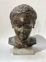 A bust of a boy by Els Van Foeken on marble plinth bust, signed to underside, 37.5cm tall x 23cm