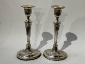A pair of Fordham & Faulkner silver Adam style candlesticks with weighted bases, Sheffield 1912,