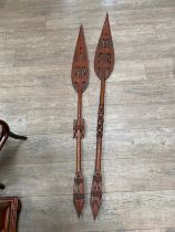 Two West African carved paddles, pierced geometric design, one a/f, 171cm & 154cm