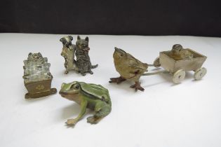 Four cold painted bronze miniature figures including chick, cat, frog and dog embracing