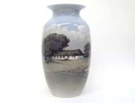 A Royal Copenhagen vase decorated with rural cottage scene, 32.5cm tall