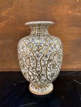 A Rorstrand high glazed stoneware urn vase with foliate decoration. Company impressed stamp to base,