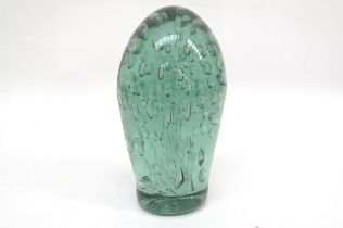 A Victorian green glass dump with bubble inclusion, 16.5cm tall