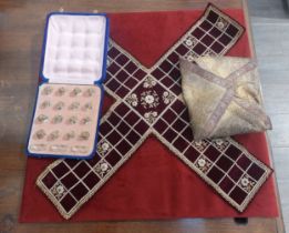 A late 19th Century pachisi/chaupar velvet game board accompanied by a cased set of sixteen counters