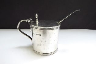 An E S Barnsley & Co (Edward Souter Barnsley) silver barrel form mustard with shell form thumb and