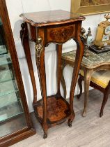 An Italian marquetry 19th Century style inlaid jardiniere two tier stand, the serpentine edge top